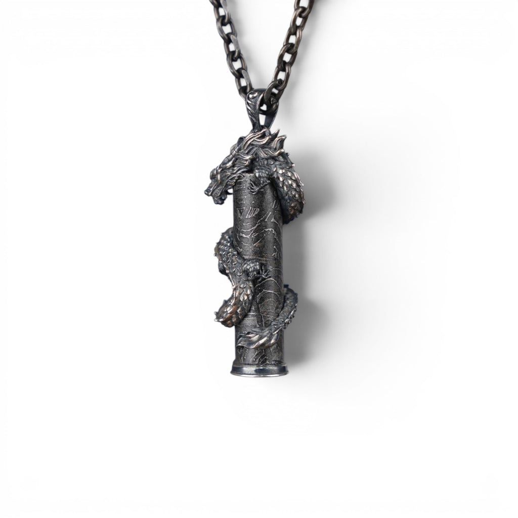 The Dragon — scale shot of the dragon pendant in hand.