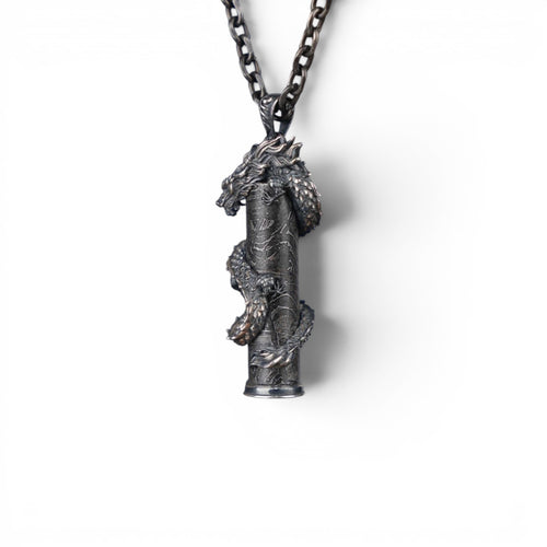 The Dragon — scale shot of the dragon pendant in hand.