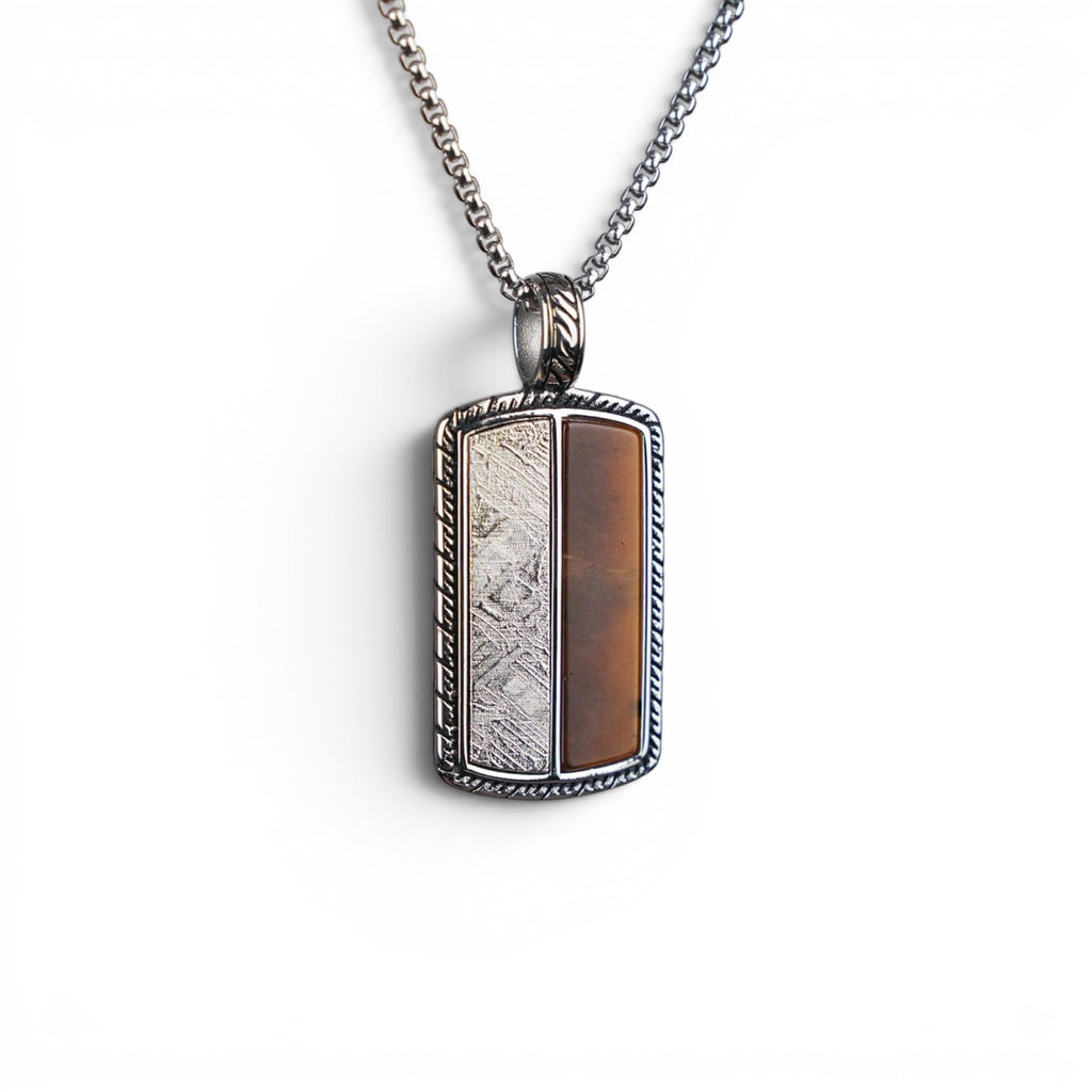 The Tiger Tag — detail of the rope-twist engraved border and carved bail.