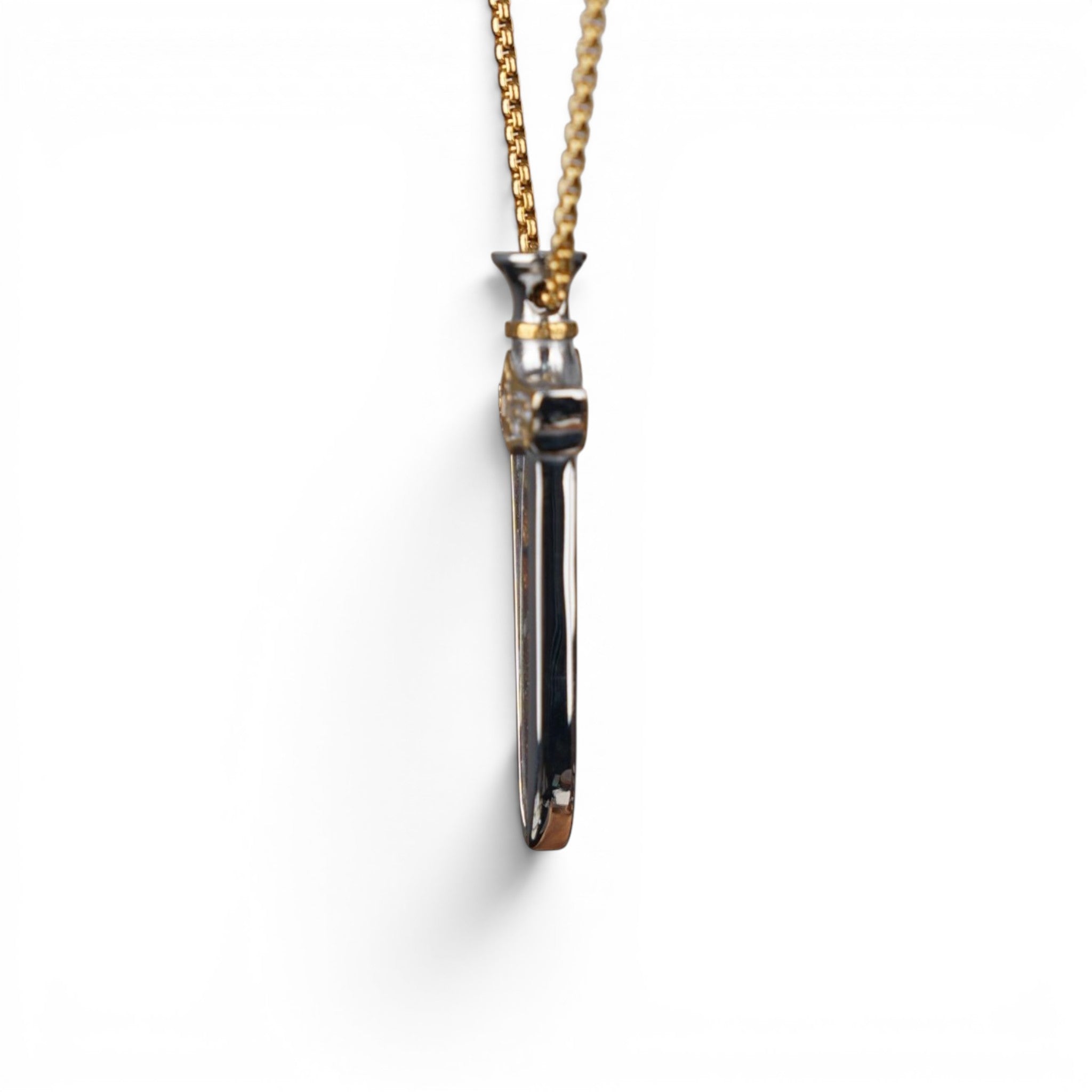 The Pallas Blade — scale shot of the blade pendant in hand.