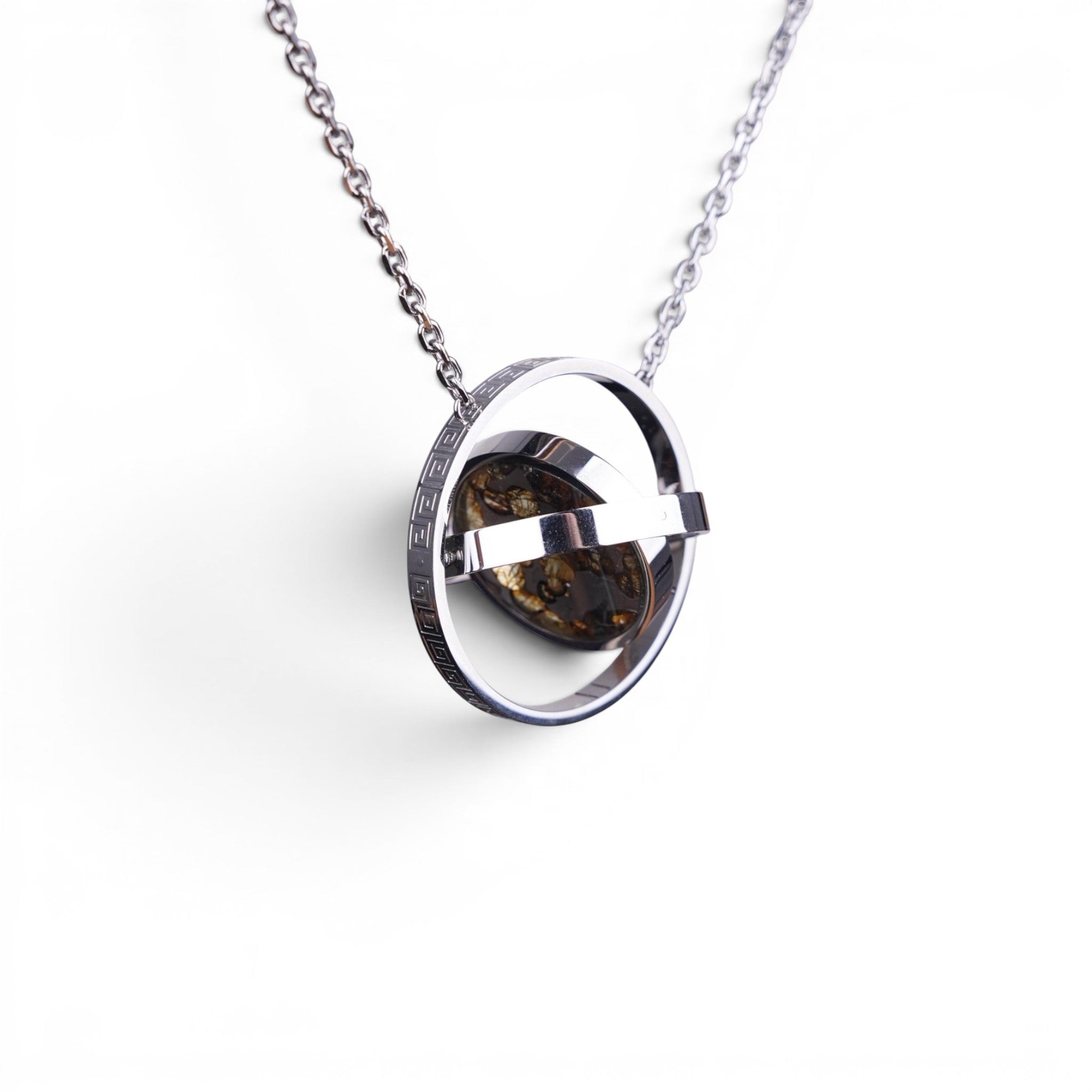 The Pallas Orrery — scale shot of the orrery pendant in hand.