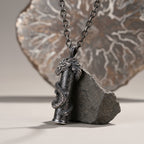 The Dragon — meteorite cylinder set beneath the dragon's head showing Aletai iron and Widmanstätten pattern.