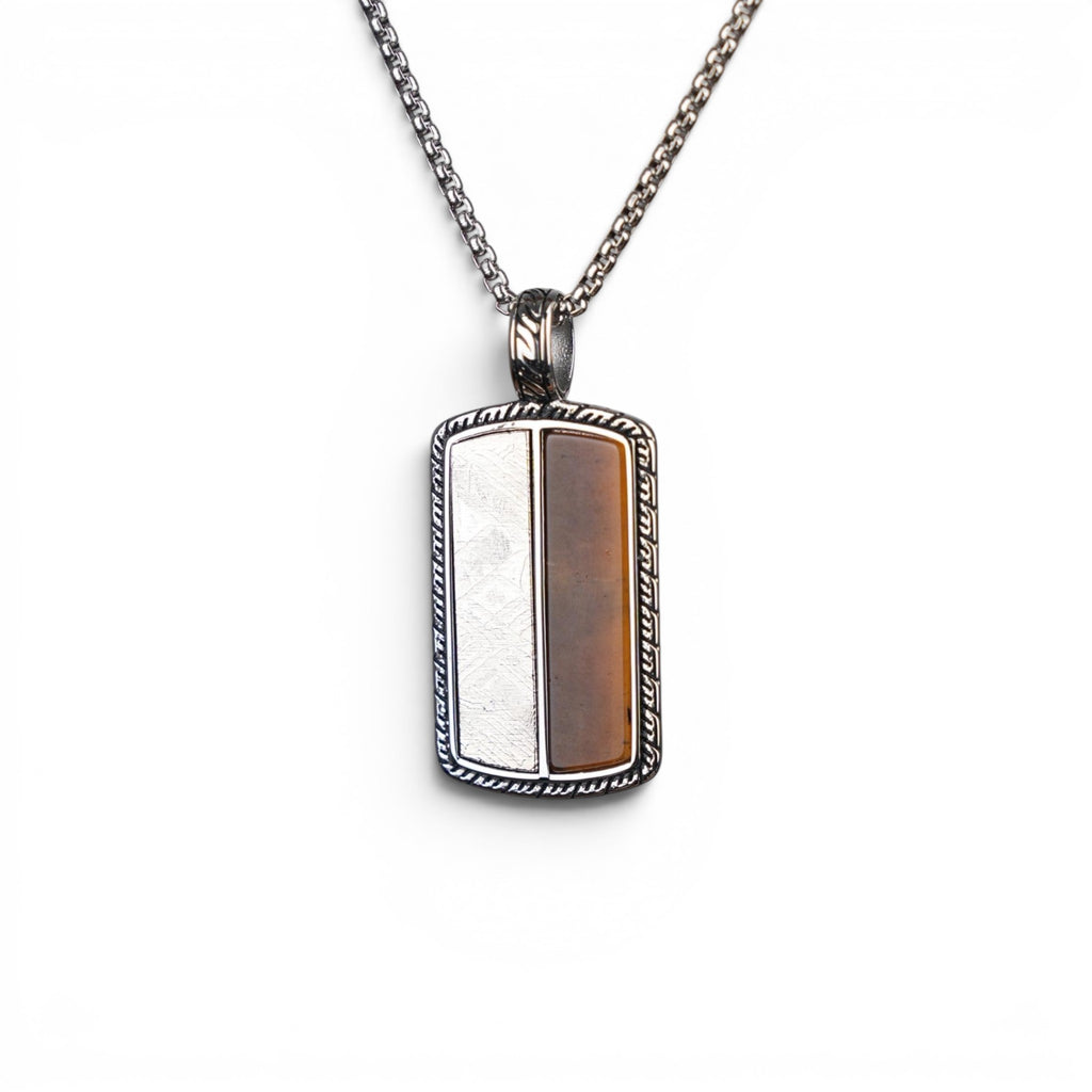 The Tiger Tag — split-face pendant worn at the chest, men's heritage jewellery.
