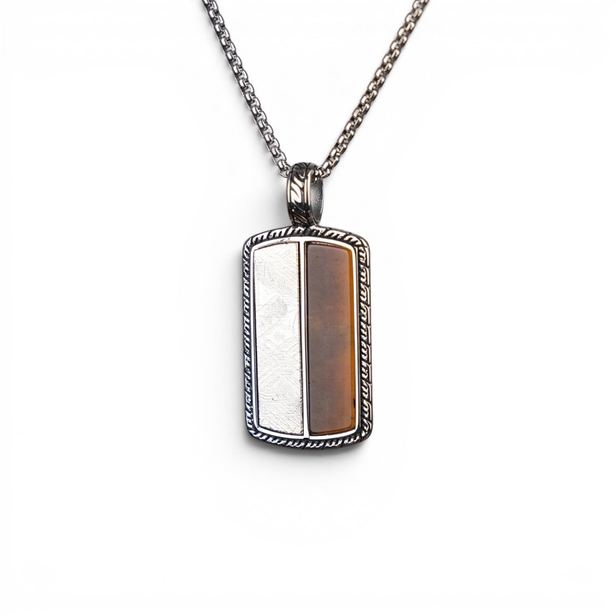 The Tiger Tag — split-face pendant worn at the chest, men's heritage jewellery.