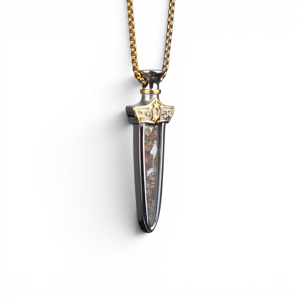 The Pallas Blade — pallasite pendant on heavy gold-tone box chain.