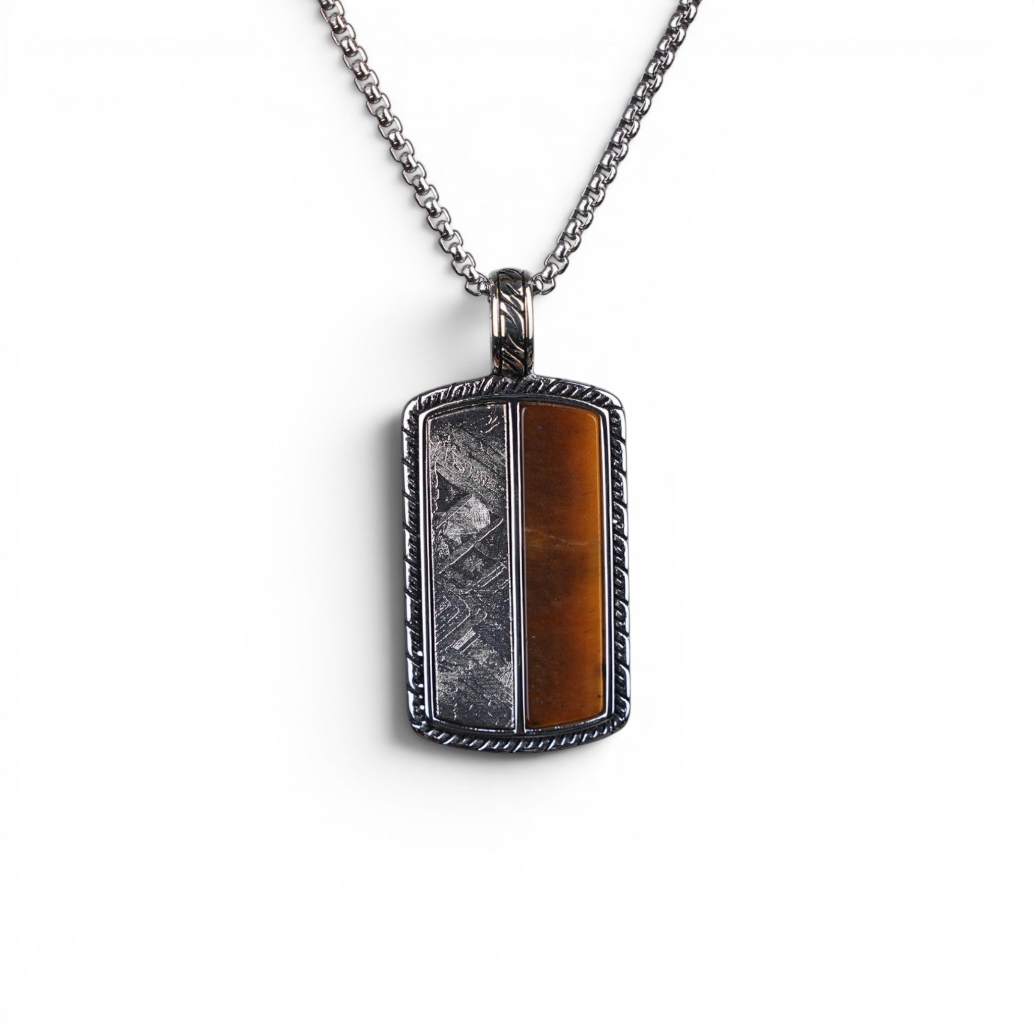 The Tiger Tag — front view of the split-face tag on dark background.